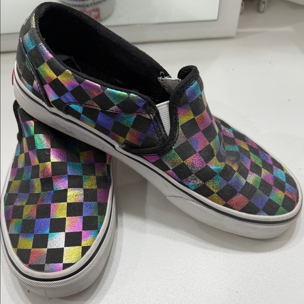 Vans Slip-On Sneakers in Black with Iridescent Rainbow Checkerboard